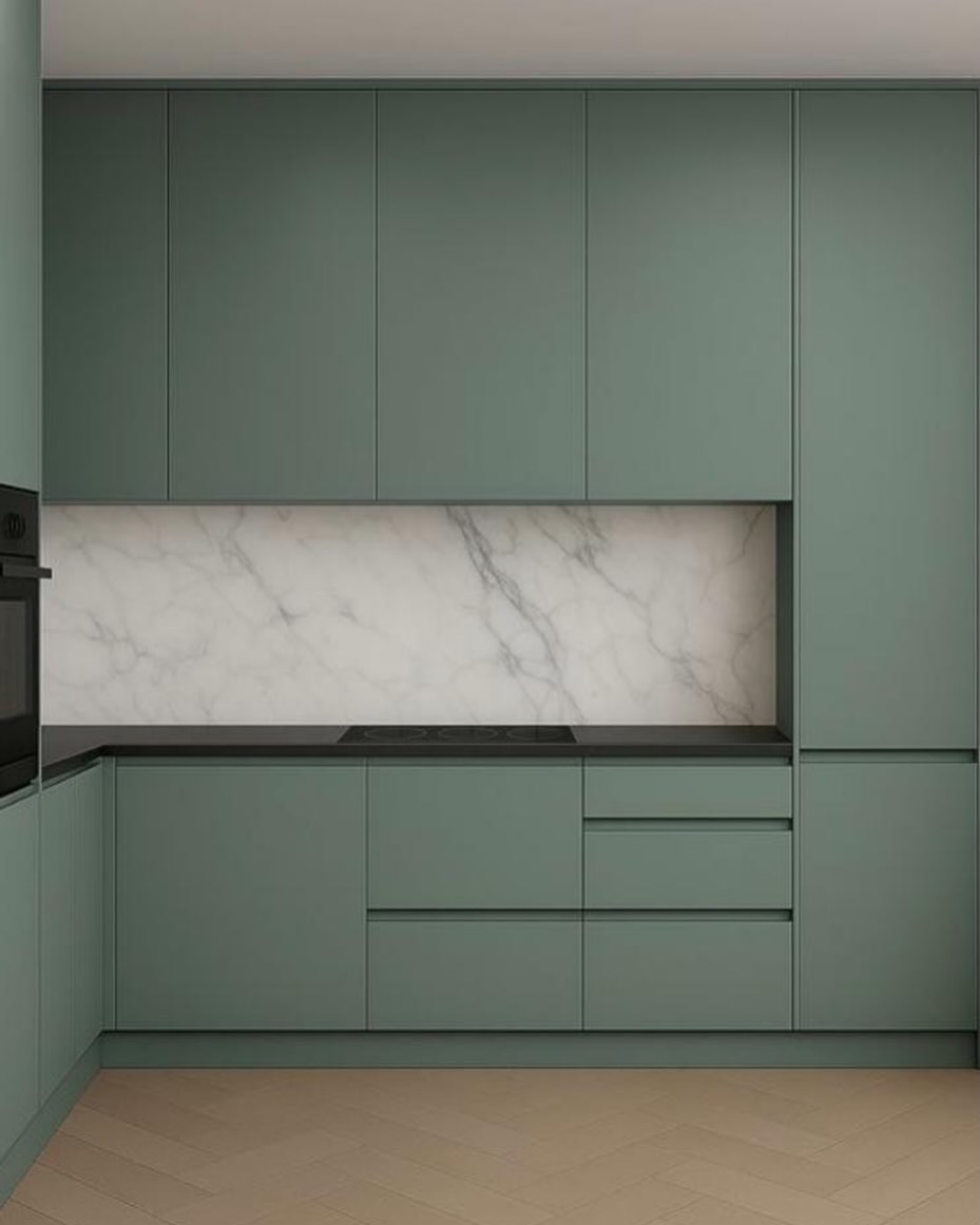 Sage green handleless kitchen with marble splashback